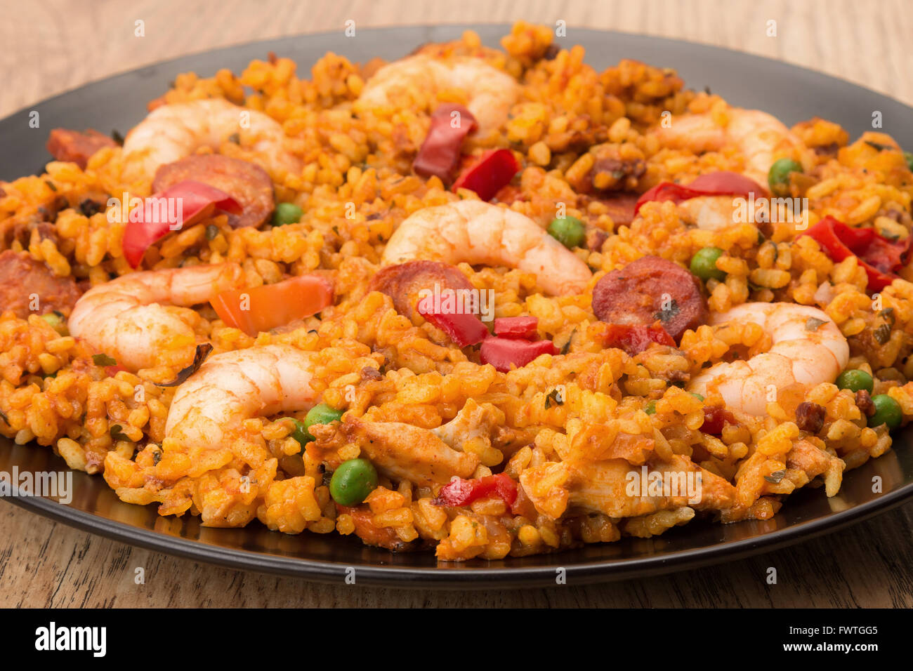 Seafood shrimp, chorizo and chicken paella studio shot Stock Photo