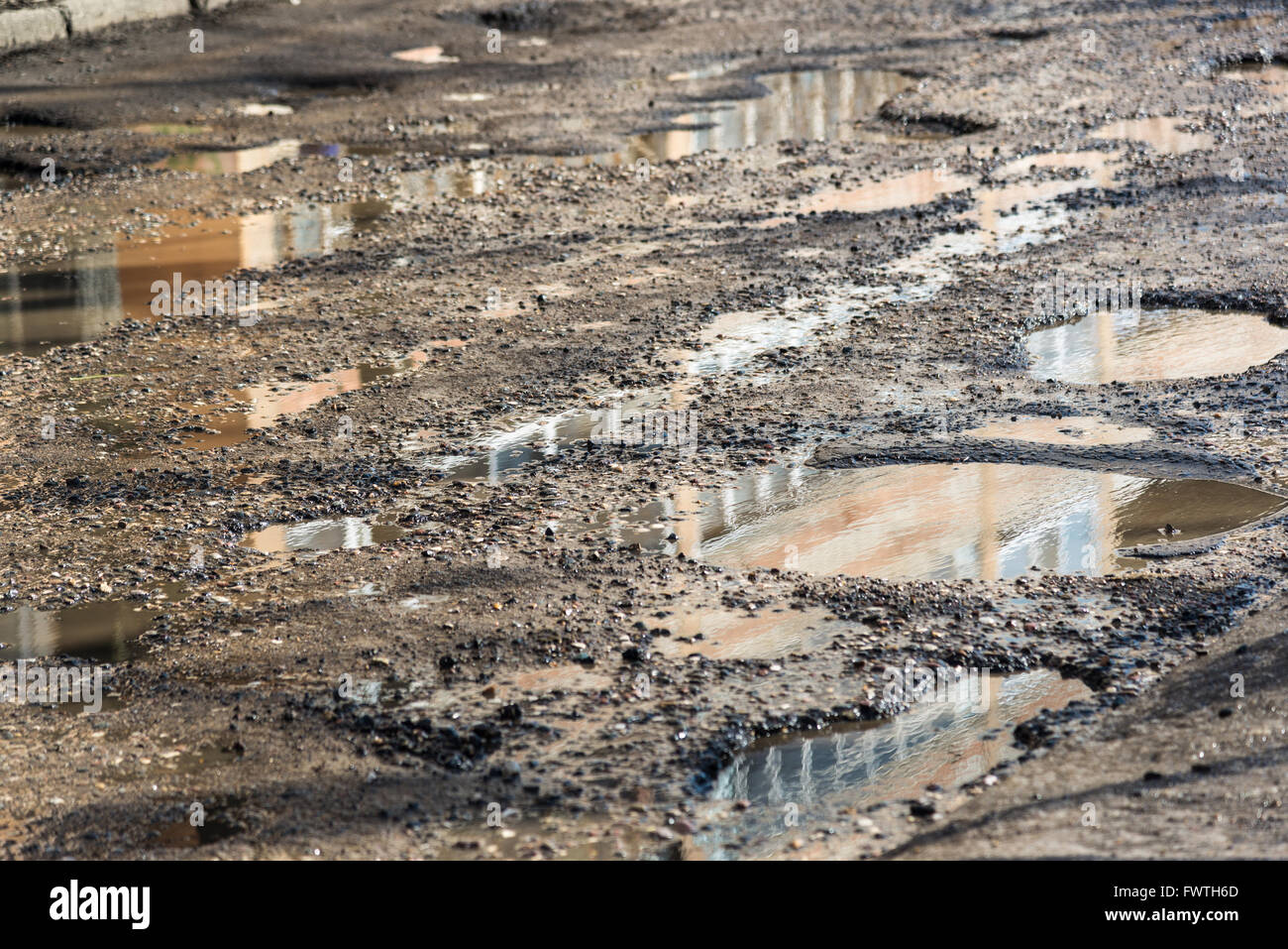 Potholes on asphalt road filled with water Stock Photo Alamy