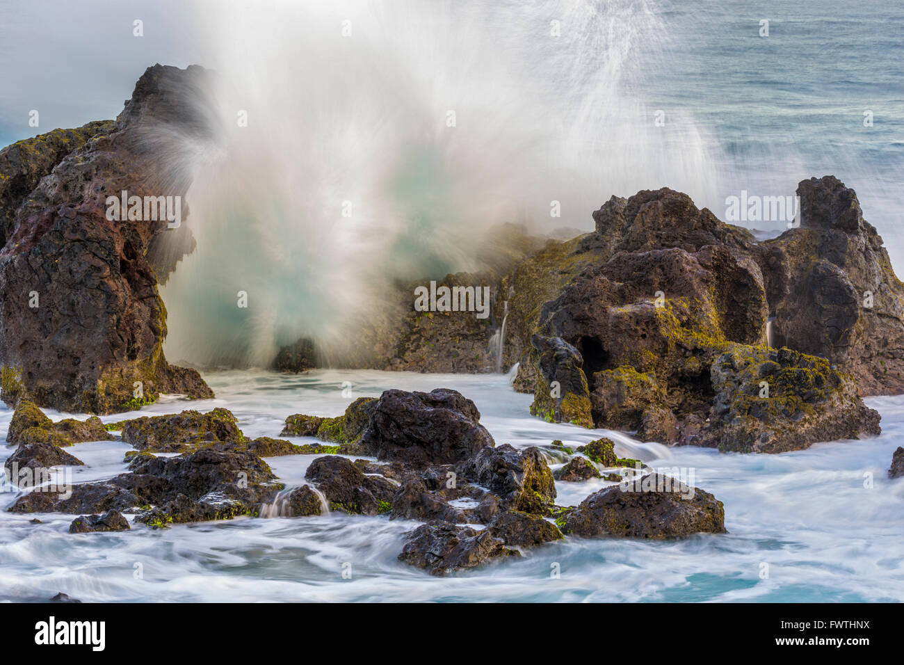Waves crashing volcanic shoreline hi-res stock photography and images ...