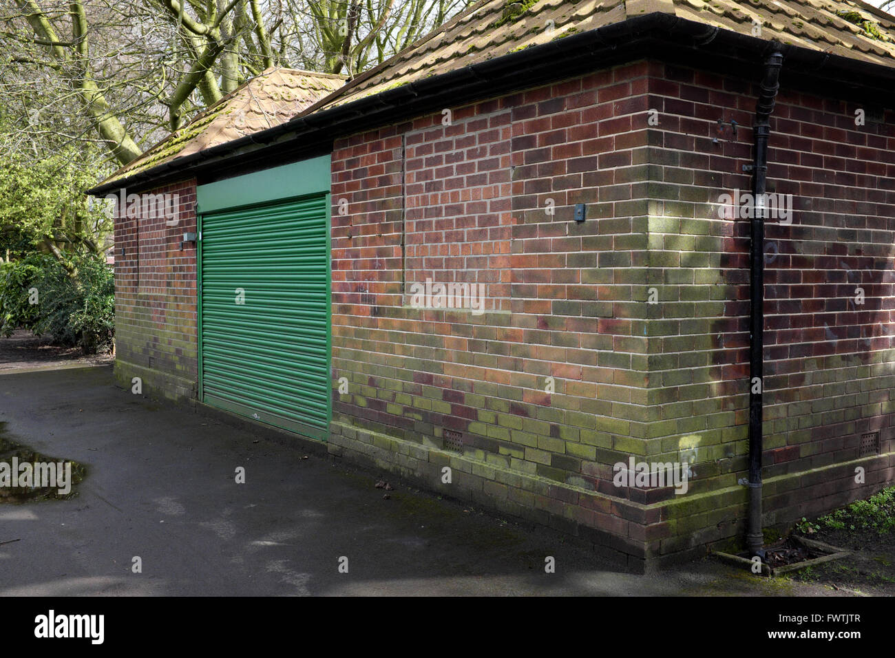 the bowling clubhouse in didsbury park has shutters at its entrance for security. Stock Photo