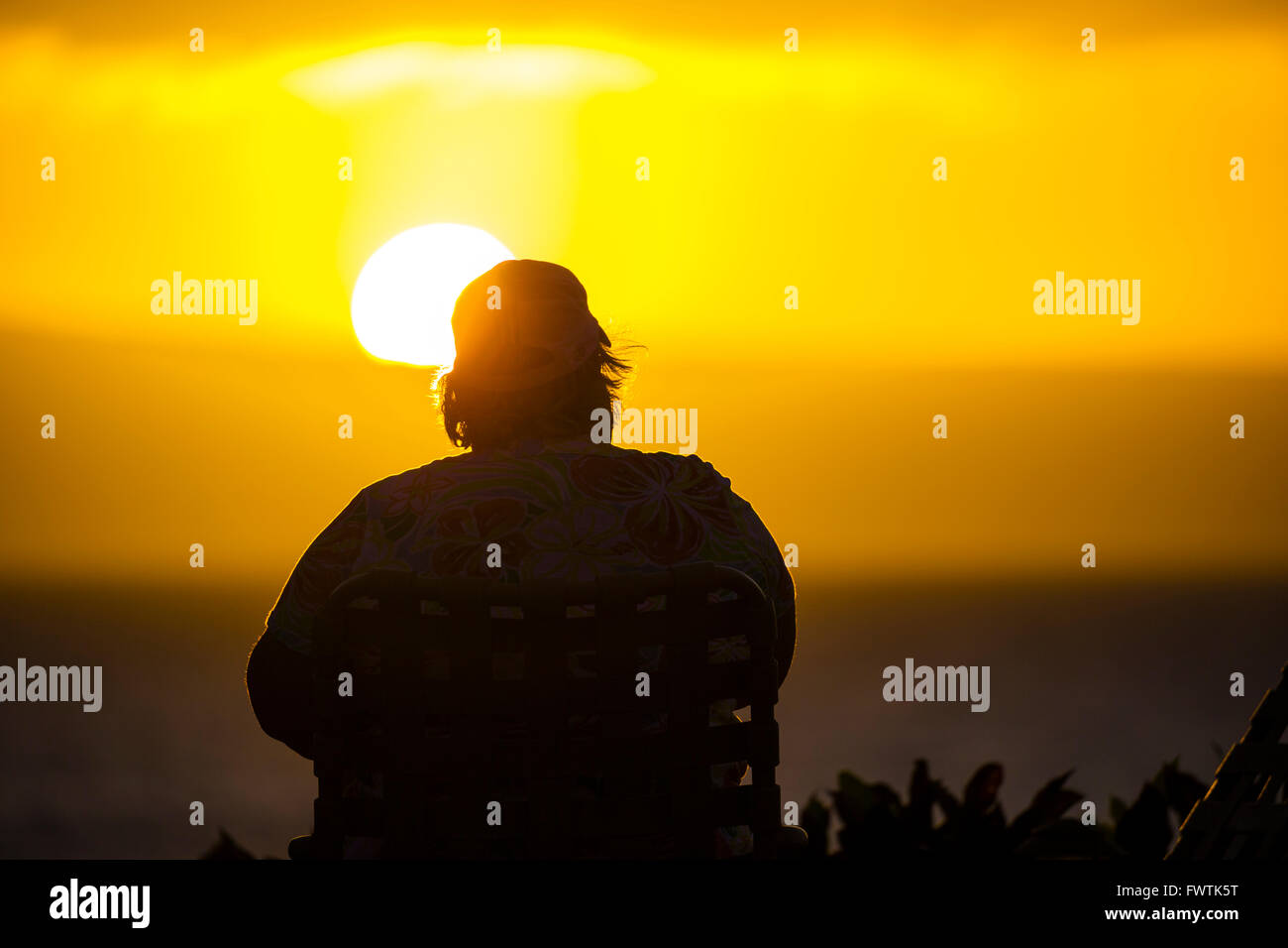 Silhouette of man in beach chair at sunset on Maui Stock Photo - Alamy