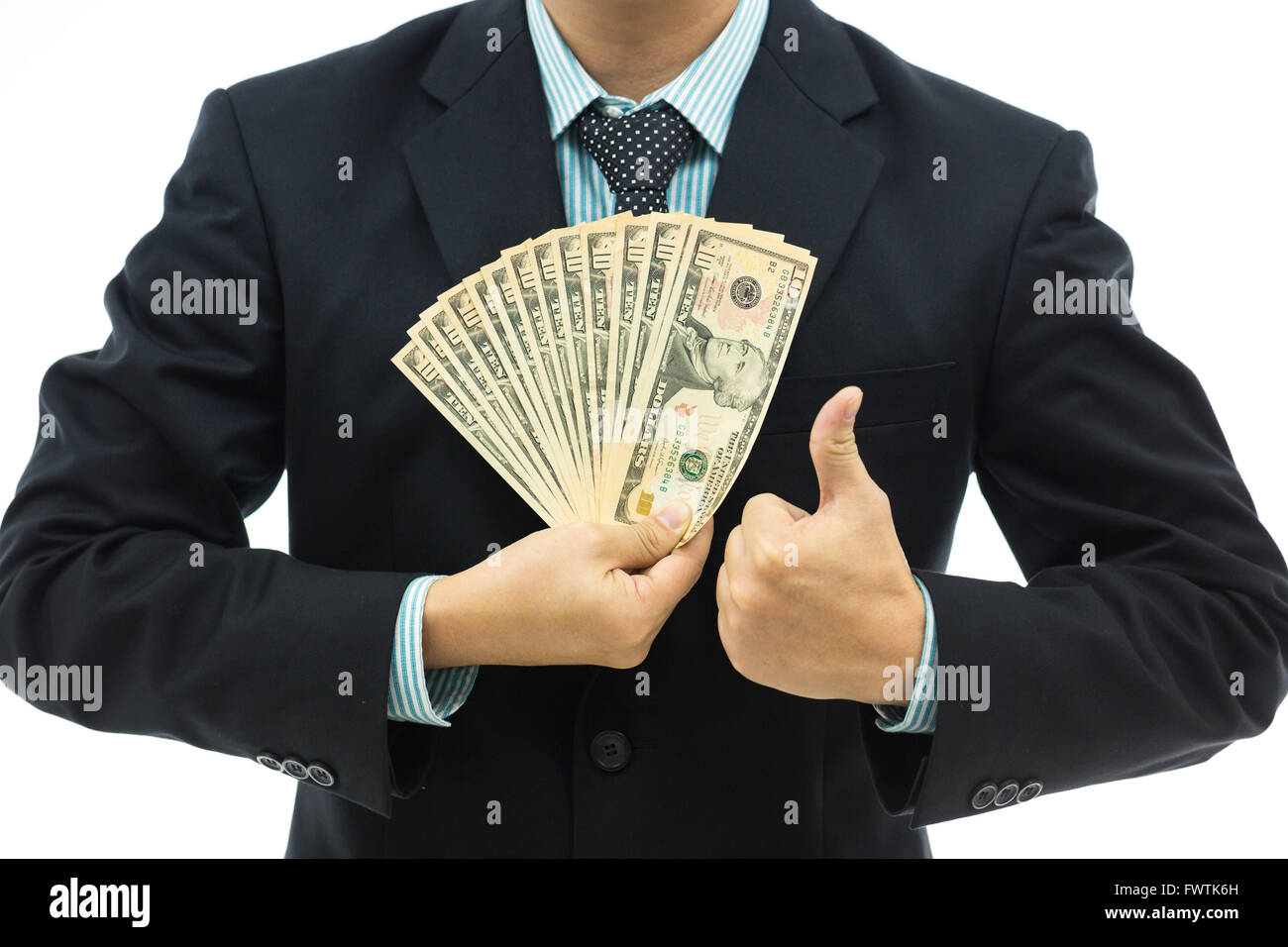 Businessman holding money isolated over white background Stock Photo ...