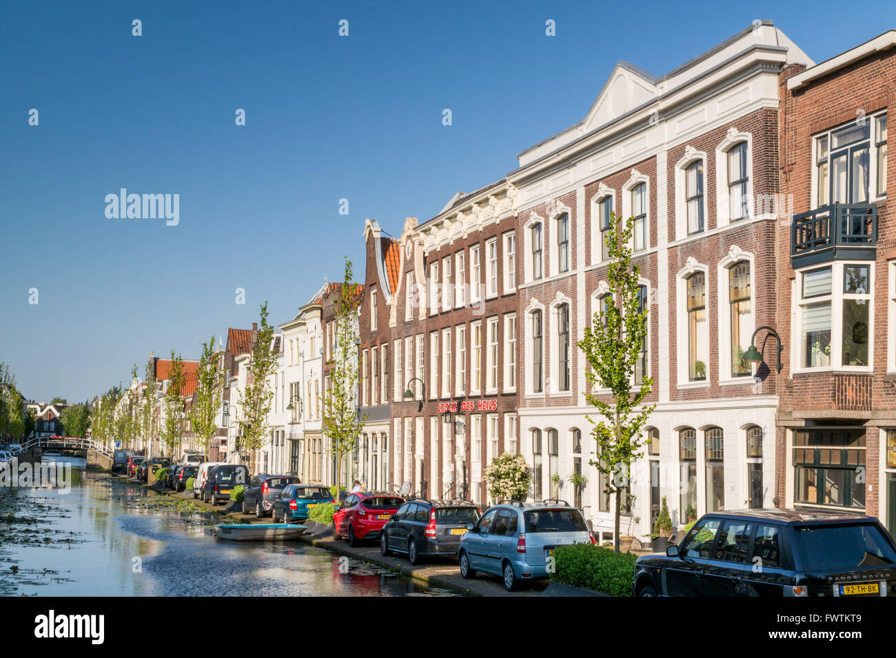Facades of old houses, Turfmarkt canal in the city of Gouda, Netherlands Stock Photo