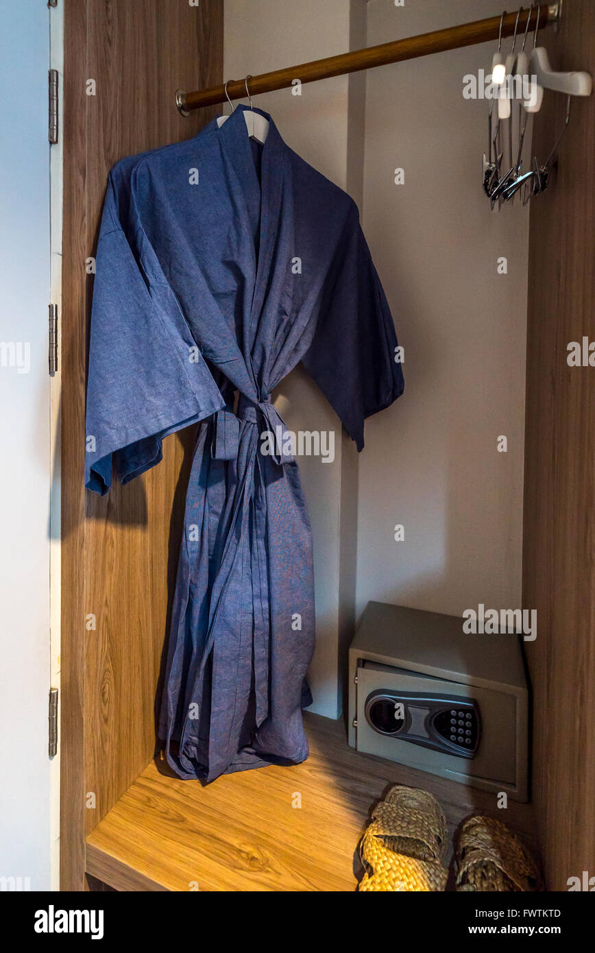 Blue bathrobe hang in wardrobe Stock Photo Alamy