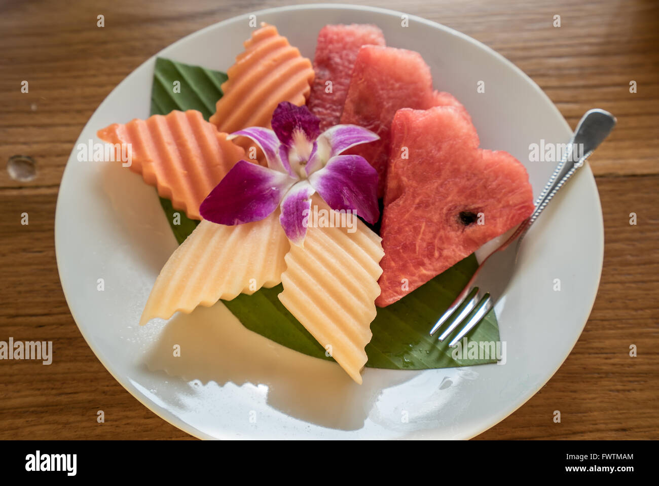 assorted tropical fruits set on white dish Stock Photo - Alamy