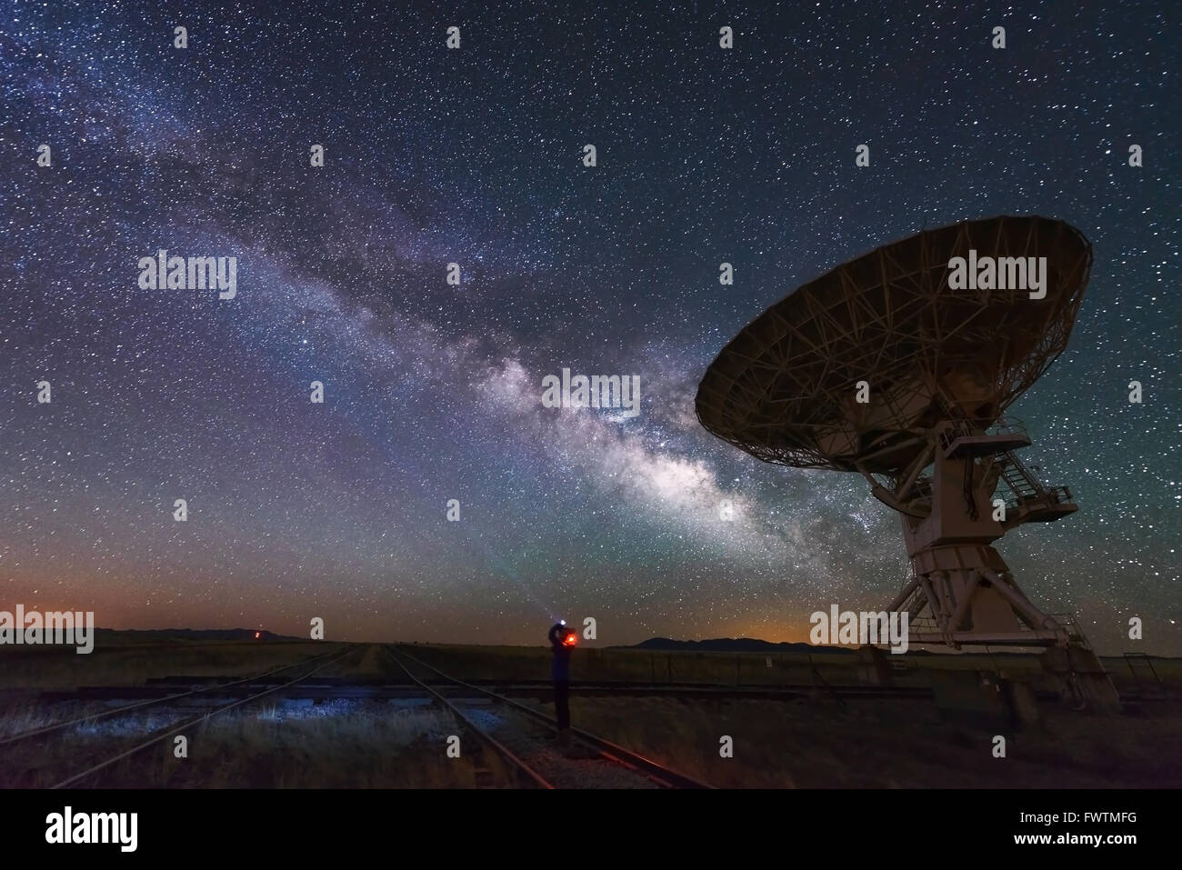 Milky way and big antenna dish at Very Large Array, New Mexico, USA. Powerful telescope for astronomy searching Stock Photo