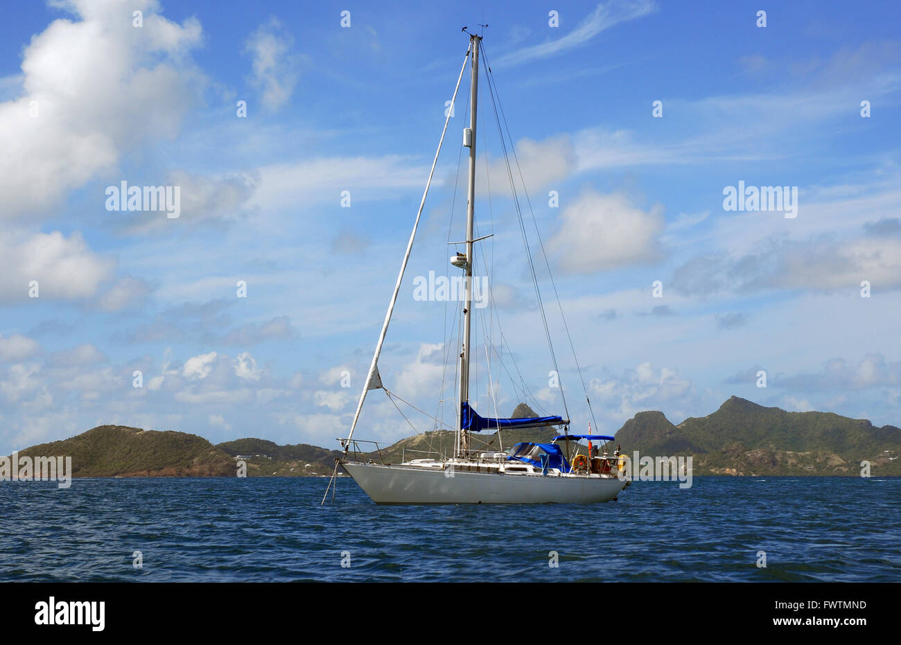Caribbean, Windward Islands, Mayreau, Saline Bay, Yacht and View to Union Island Stock Photo