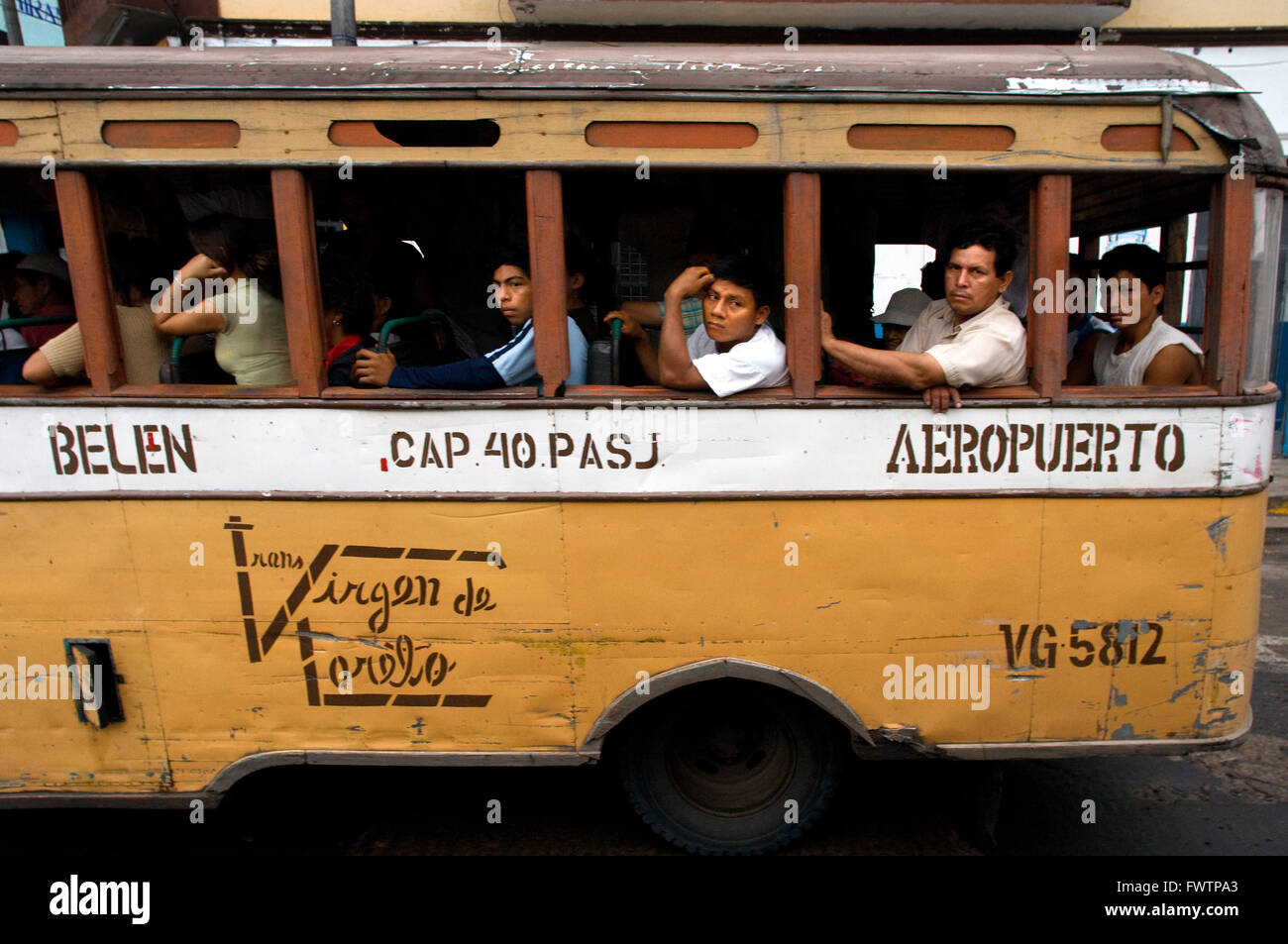 Small bus serving as public transportation in Iquitos, Loreto, Peru. Passenger bus covering the route between the airport and downtown Iquitos. Stock Photo