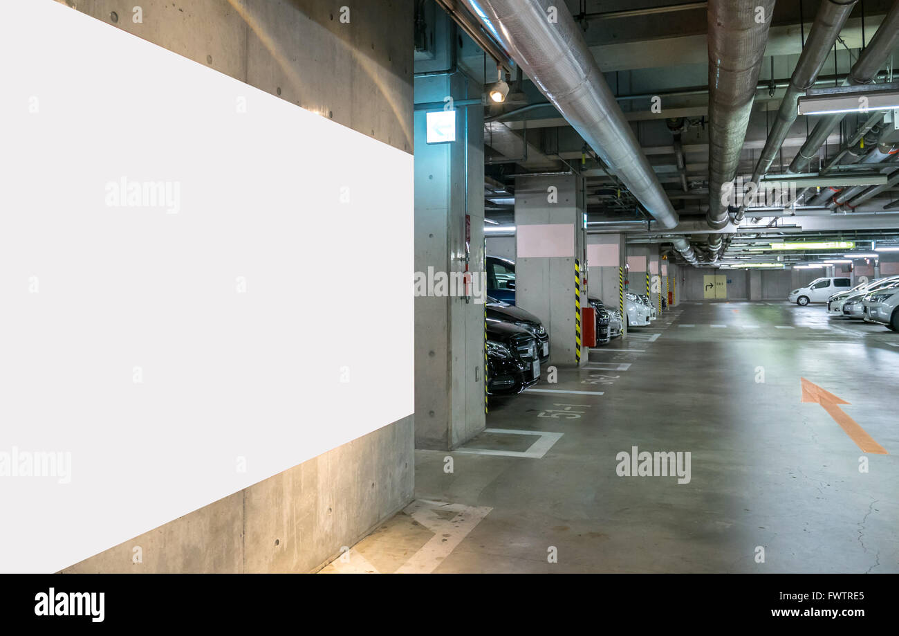 Parking garage underground, interior shopping mall at night Stock Photo