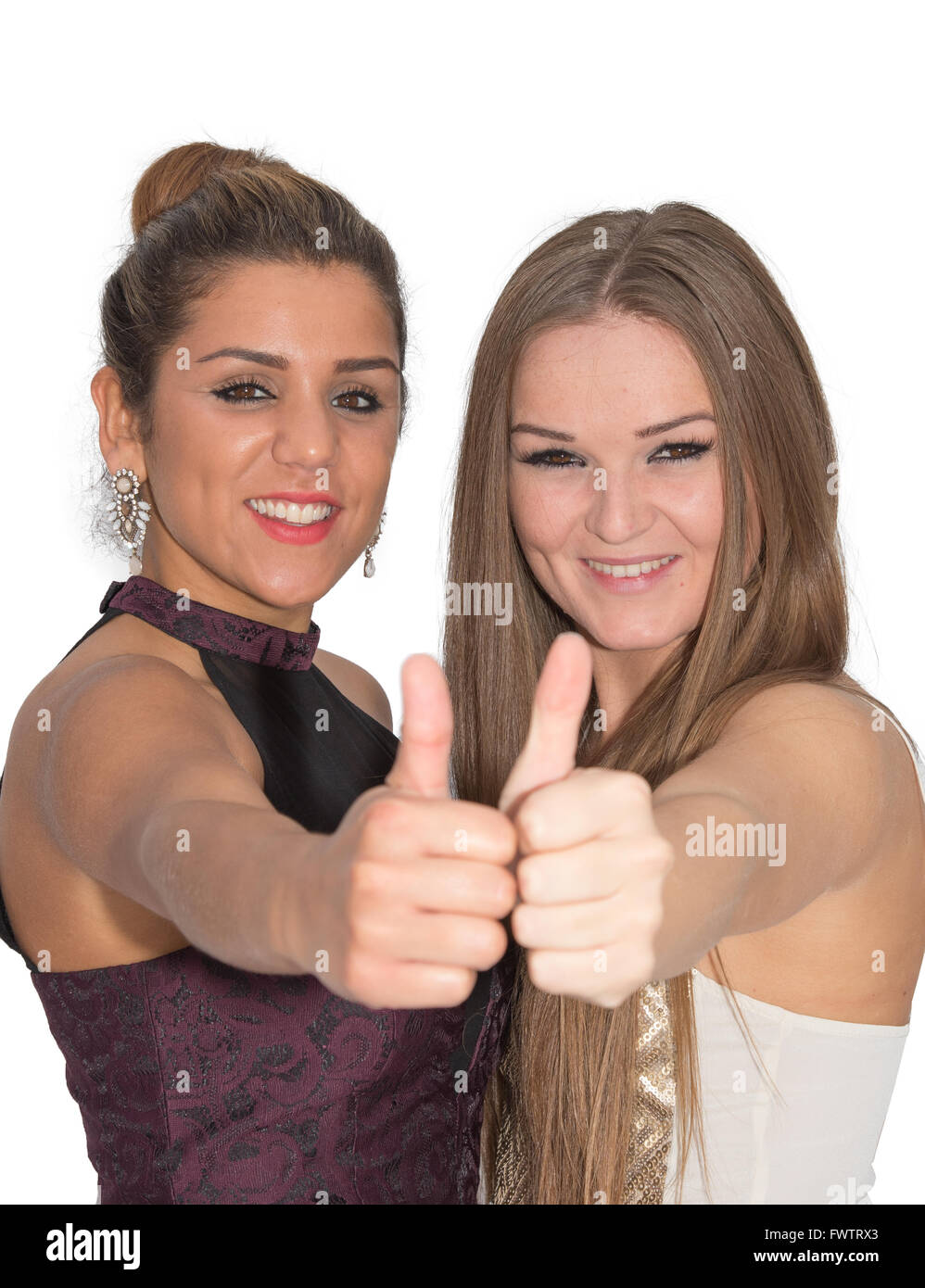 Two attrative women giving a thumbs up Stock Photo
