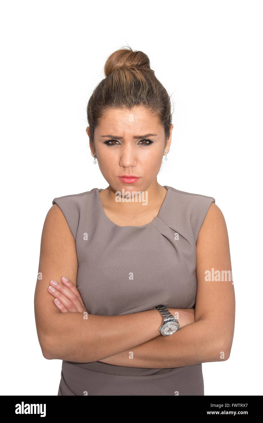 An angry woman frowning with her arms crossed Stock Photo