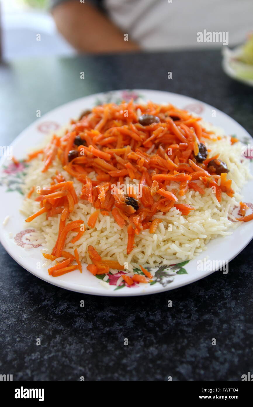Exotic Afghan cuisine, rice with carrot and raisins Stock Photo