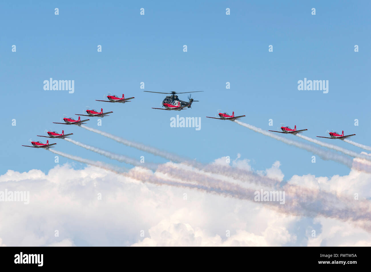 Swiss Air Force Pilatus PC-7 Formation team flying with Super Puma Stock  Photo - Alamy