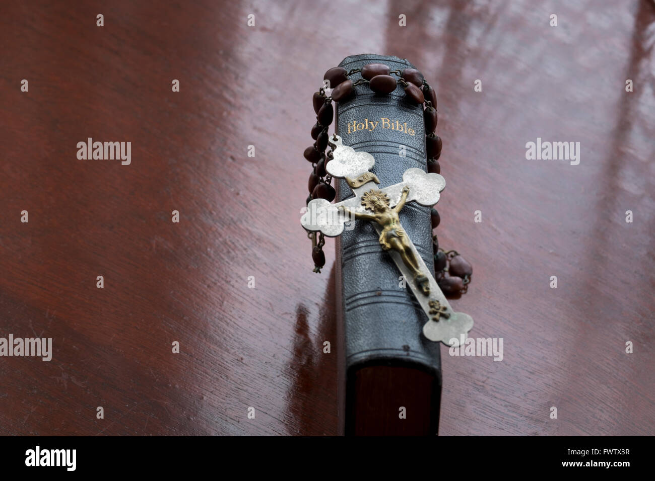 antique rosary beads with crucifix pictured with copy of holy bible Stock Photo