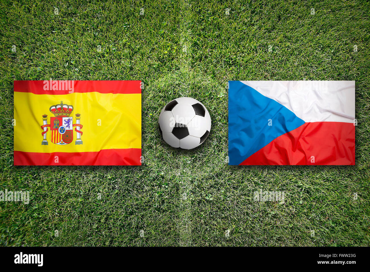 Spain vs. Czech Republic flags on green soccer field Stock Photo