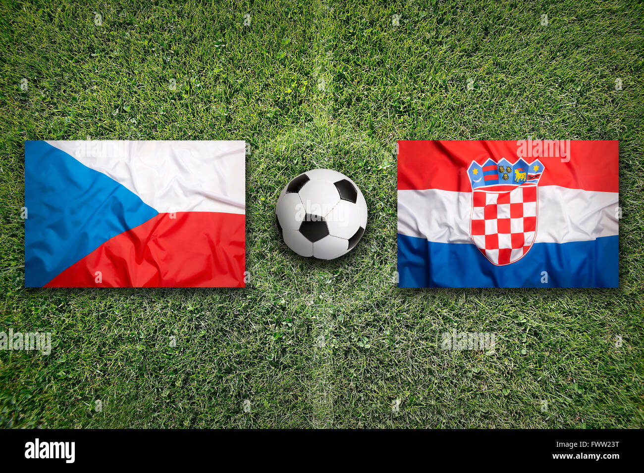 Czech Republic vs. Croatia flags on green soccer field Stock Photo