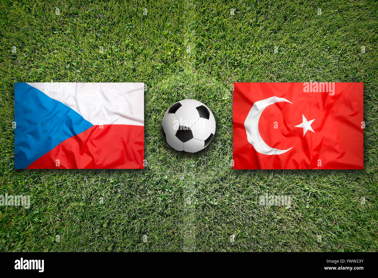 Czech Republic vs. Turkey flags on green soccer field Stock Photo