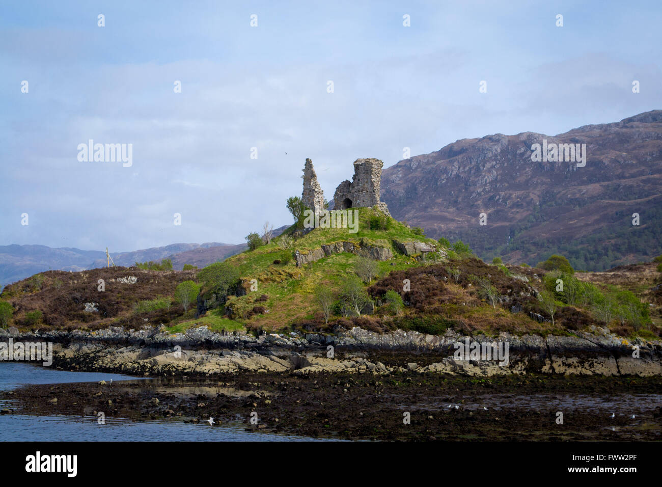Stone ruins by the ocean near the Isle of Skye in the Scottish highlands Stock Photo