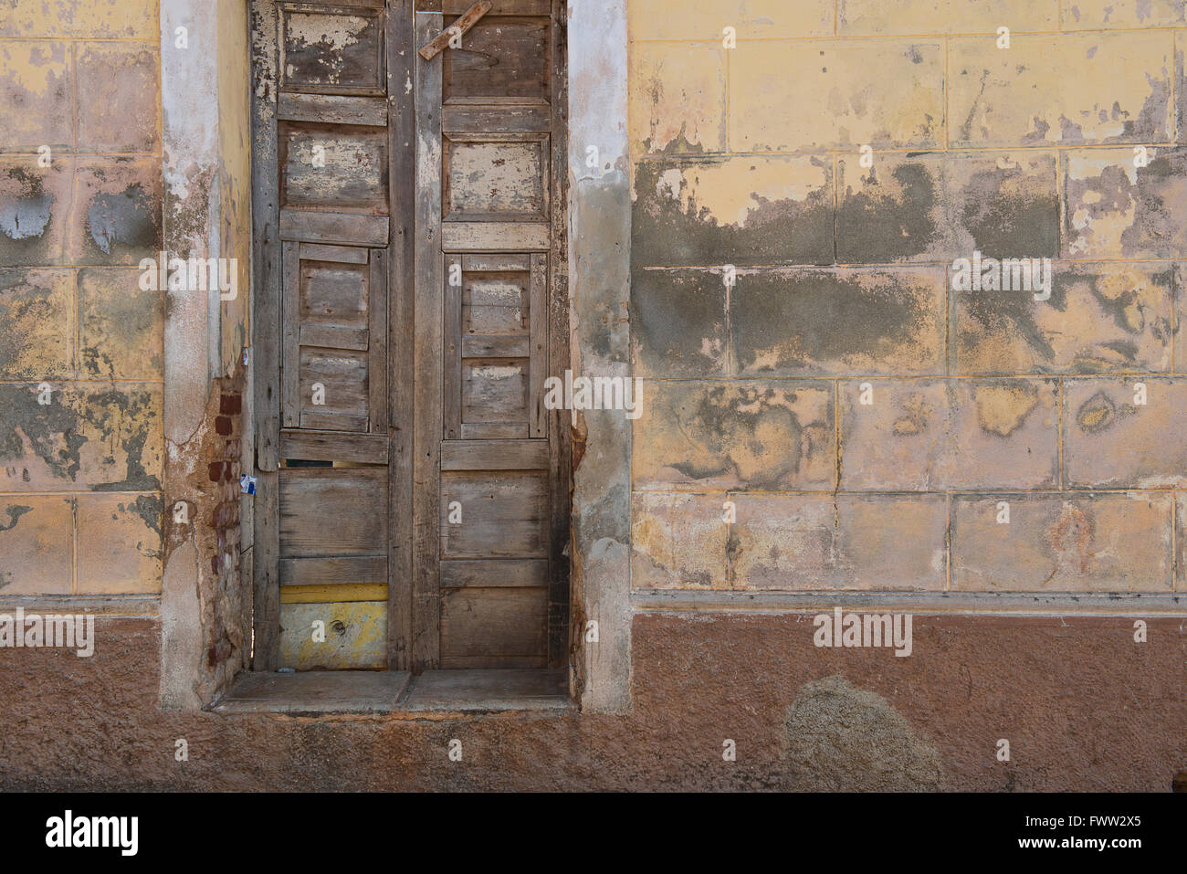 A wall of different colors and textures in the old Cuban town of Trinidad. Stock Photo
