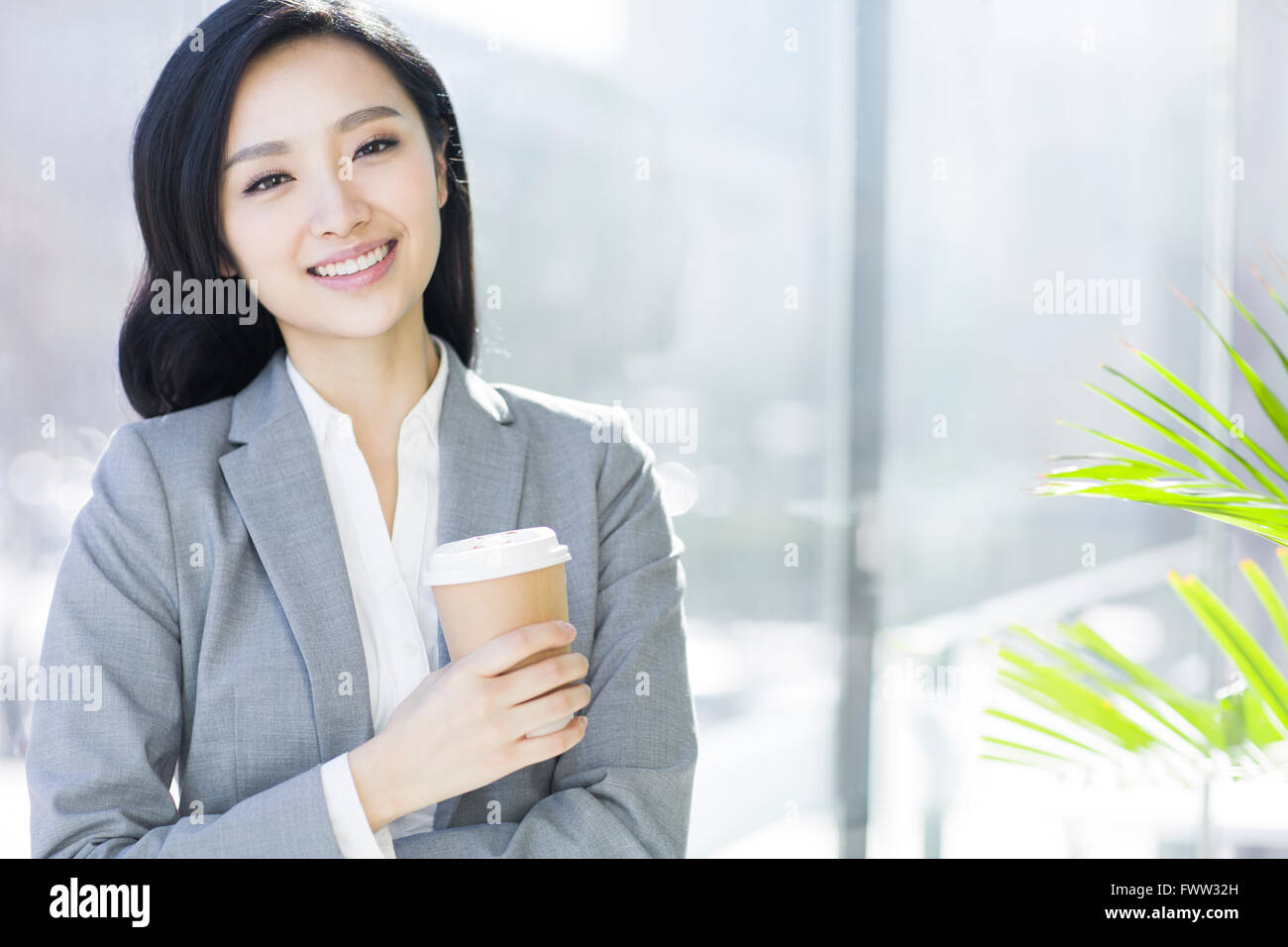 Businesswoman taking a coffee break Stock Photo - Alamy