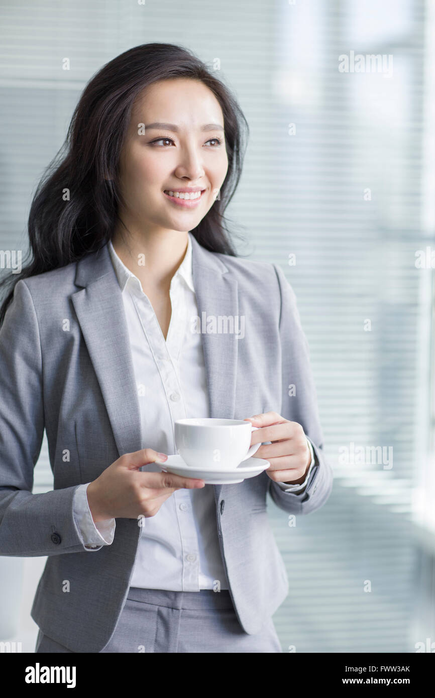 Businesswoman taking a coffee break Stock Photo - Alamy