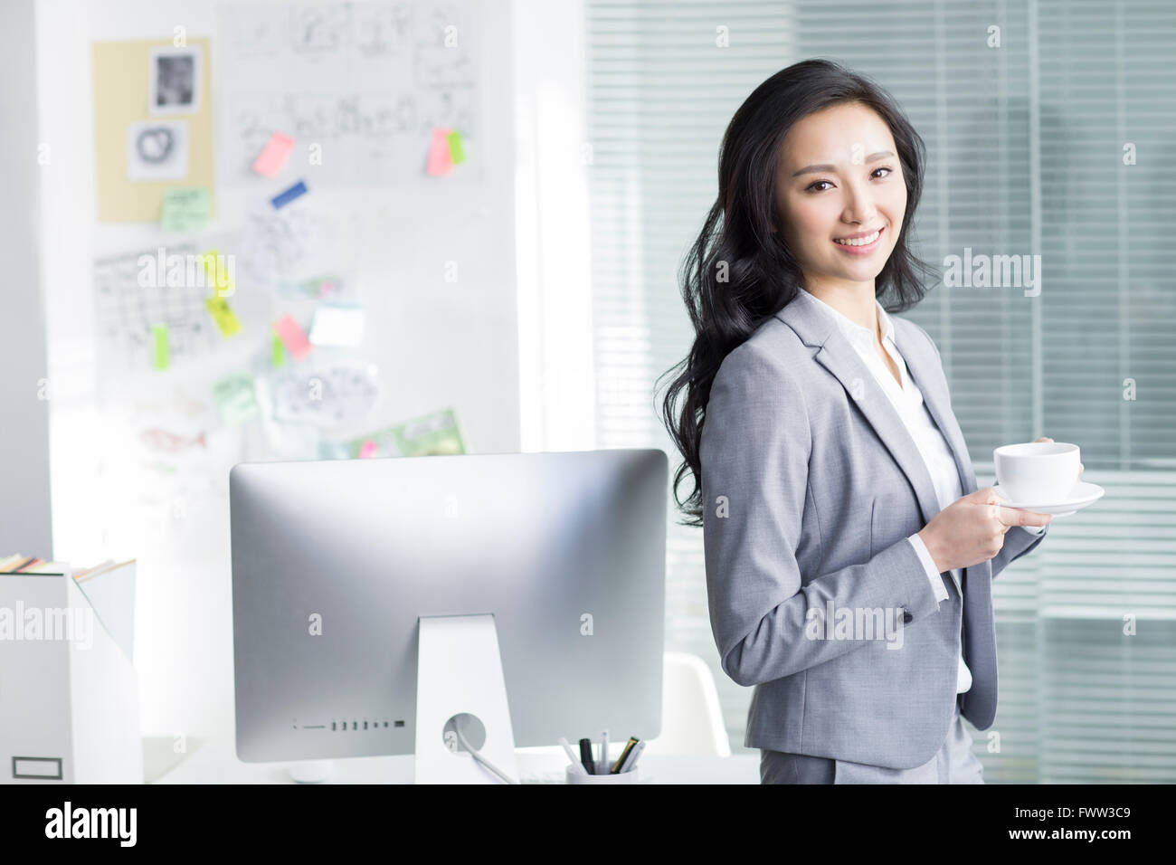 Businesswoman taking a coffee break Stock Photo - Alamy