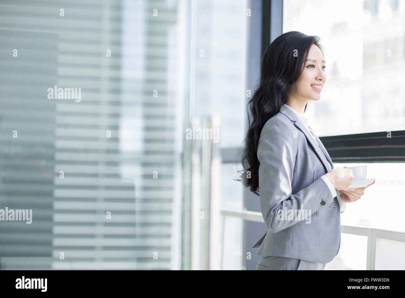 Businesswoman taking a coffee break Stock Photo - Alamy