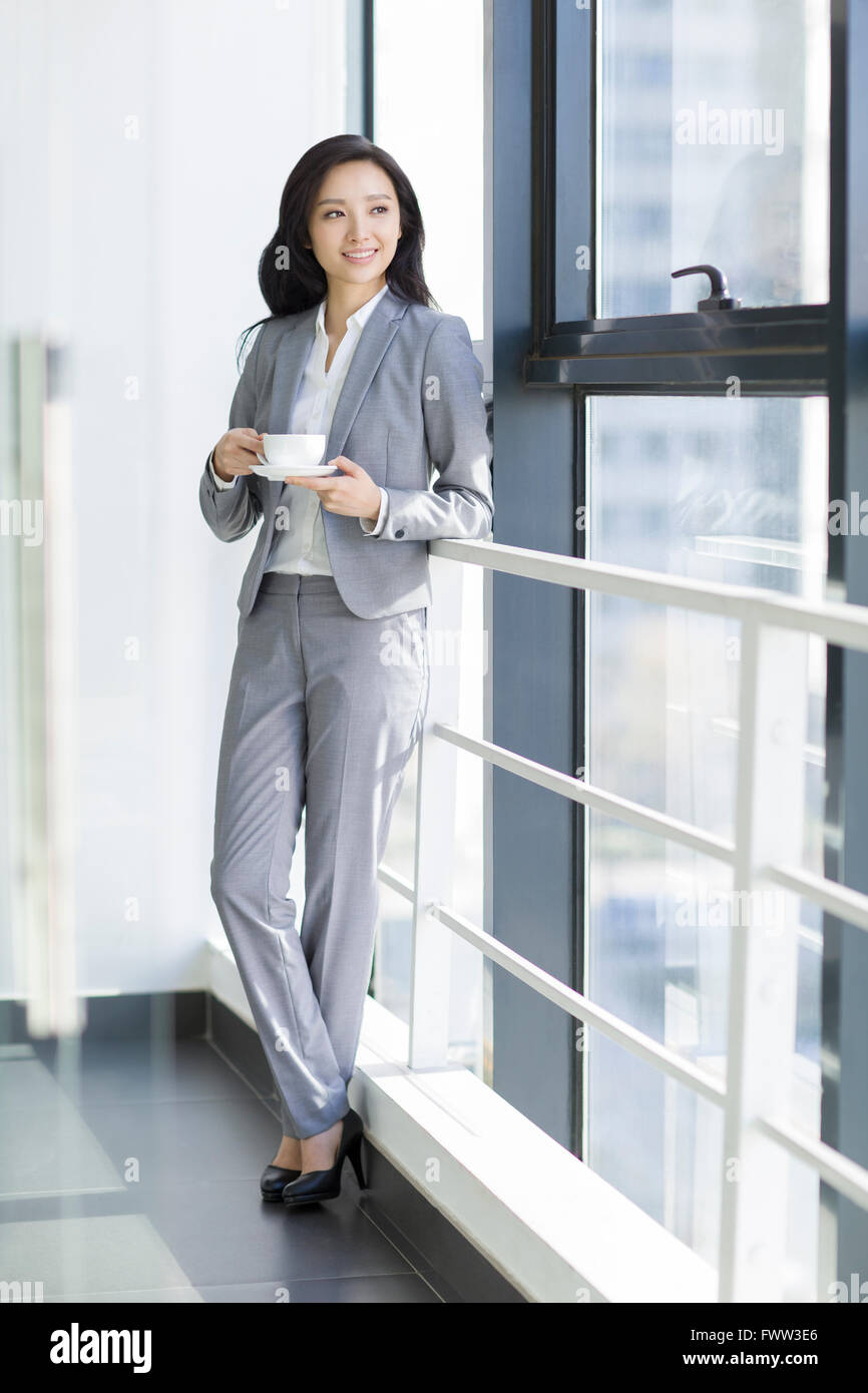 Businesswoman taking a coffee break Stock Photo - Alamy
