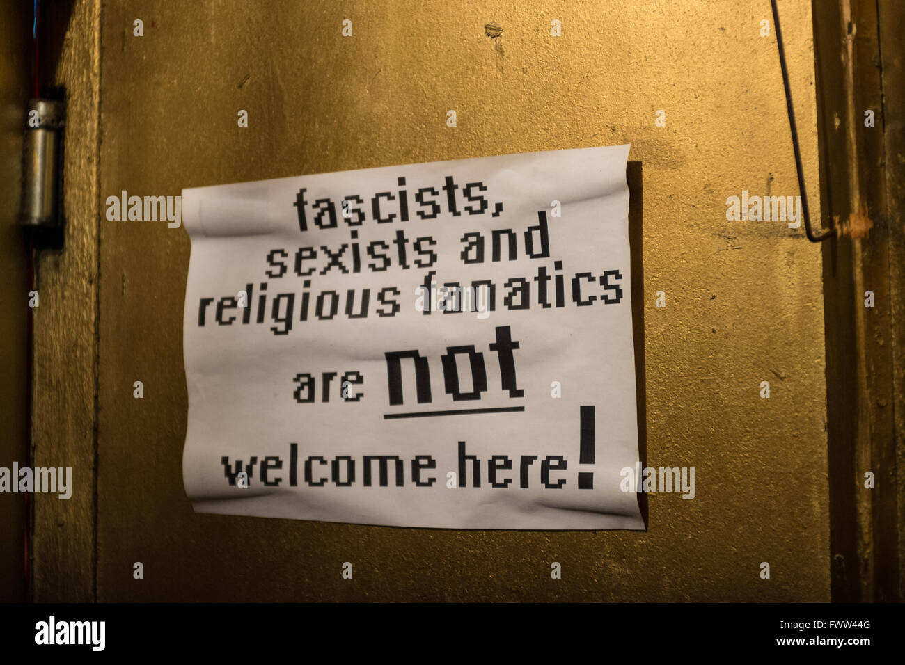 Anti Homophobic sign in a bar, Berlin, Germany Stock Photo