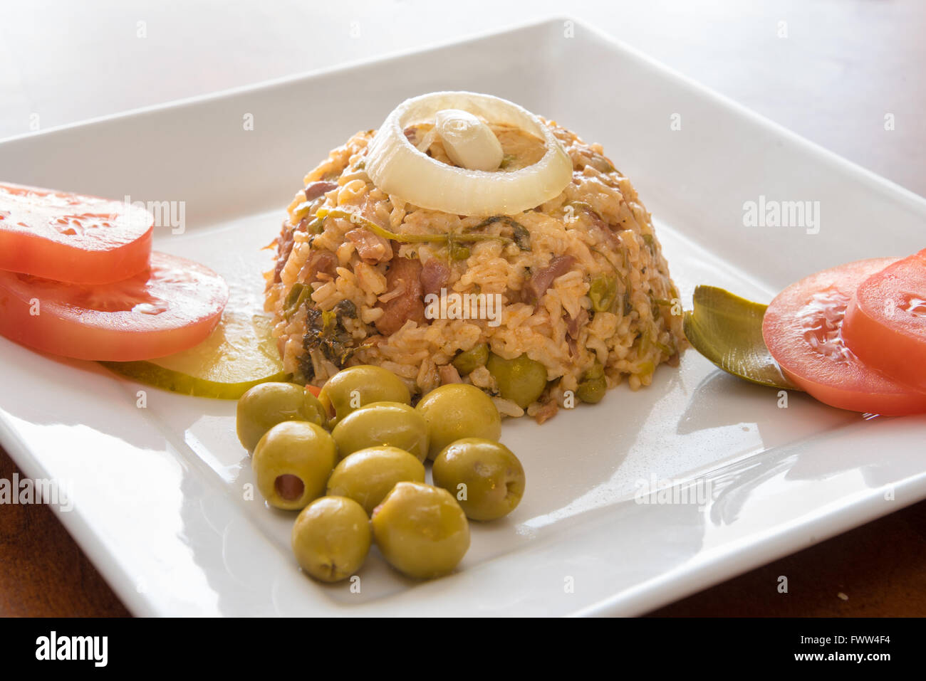 Cuban cuisine traditional creole yellow rice garnished with olives
