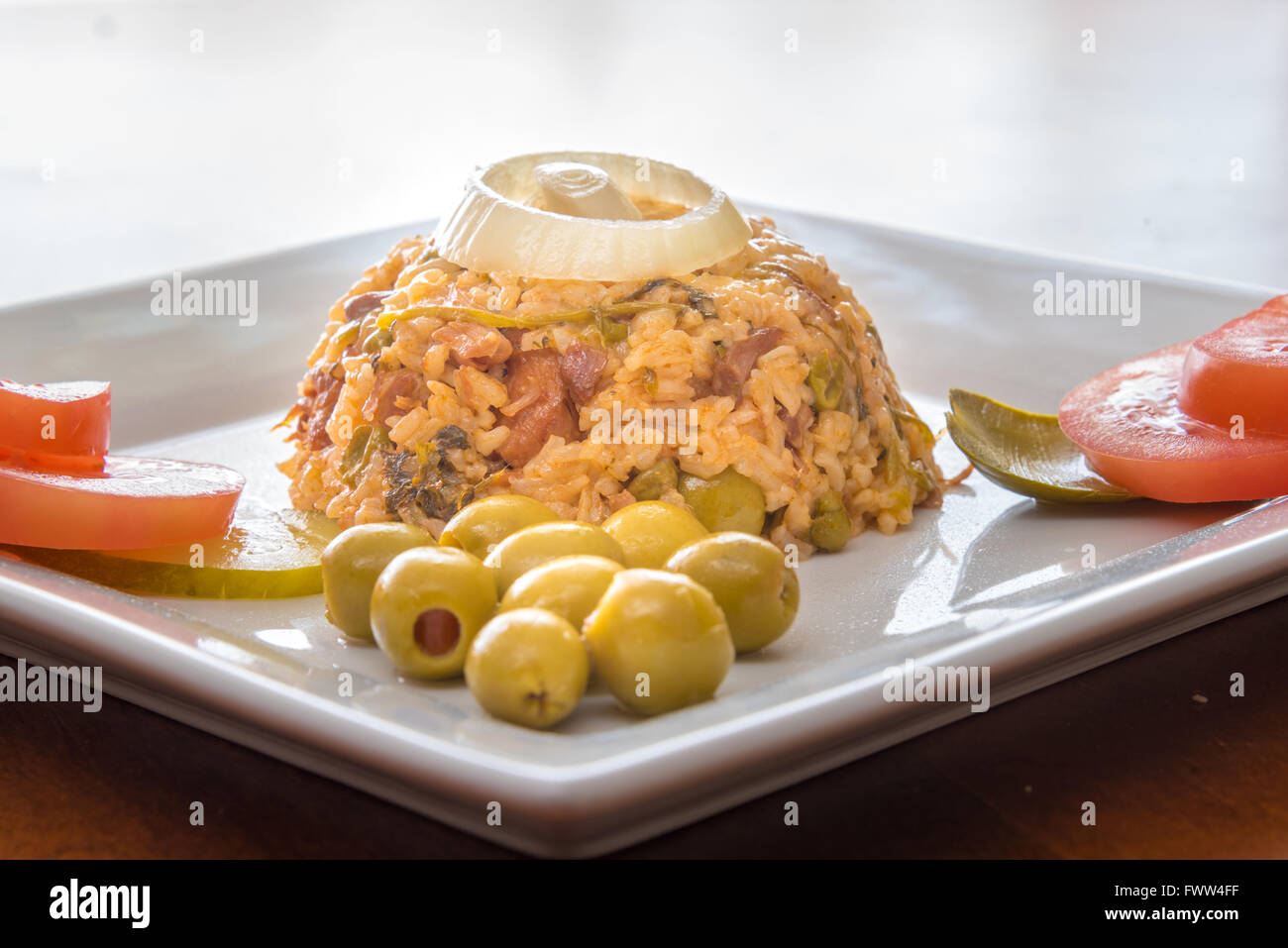 Cuban cuisine traditional creole yellow rice garnished with olives