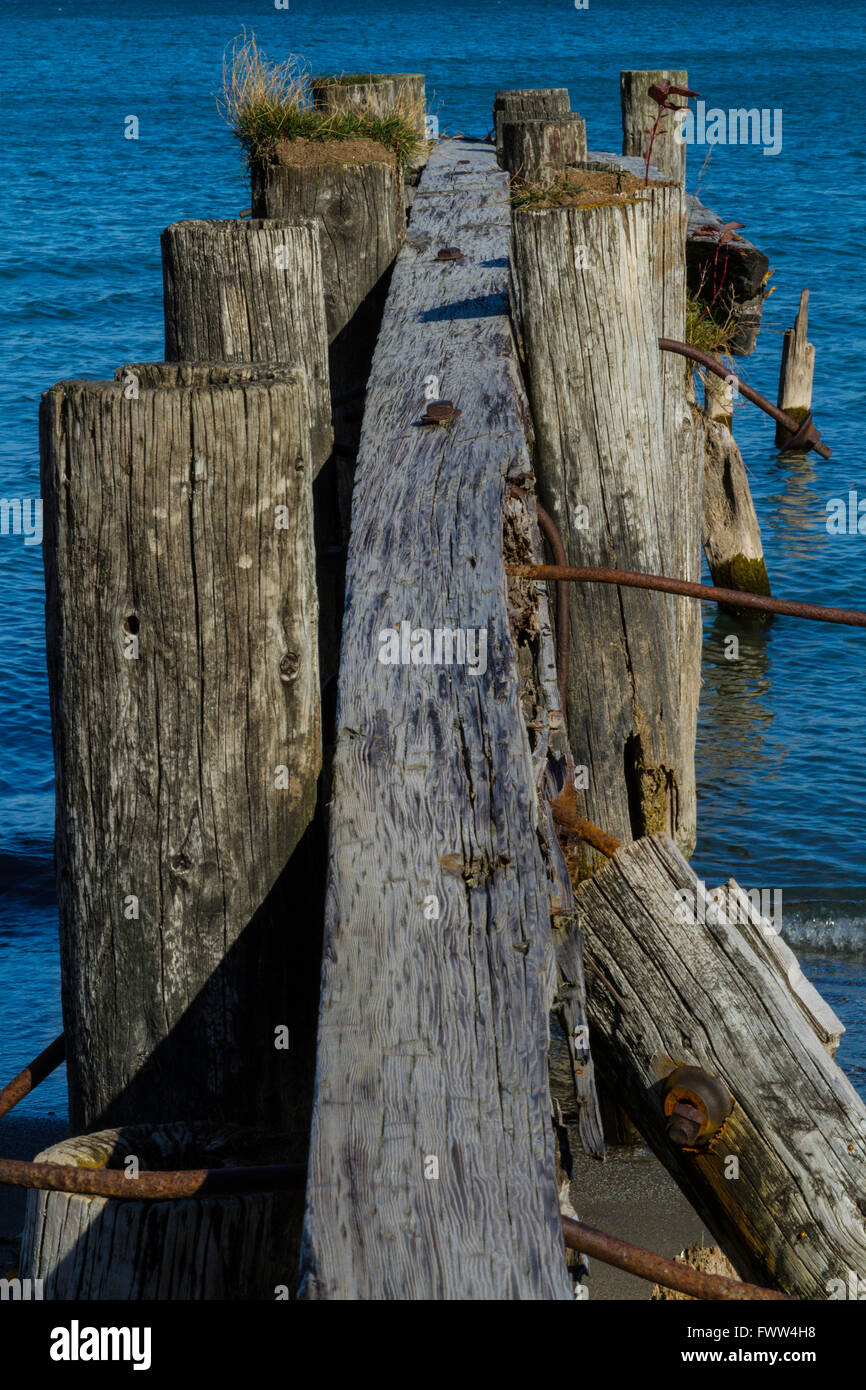Old rotting wooden pier support Stock Photo