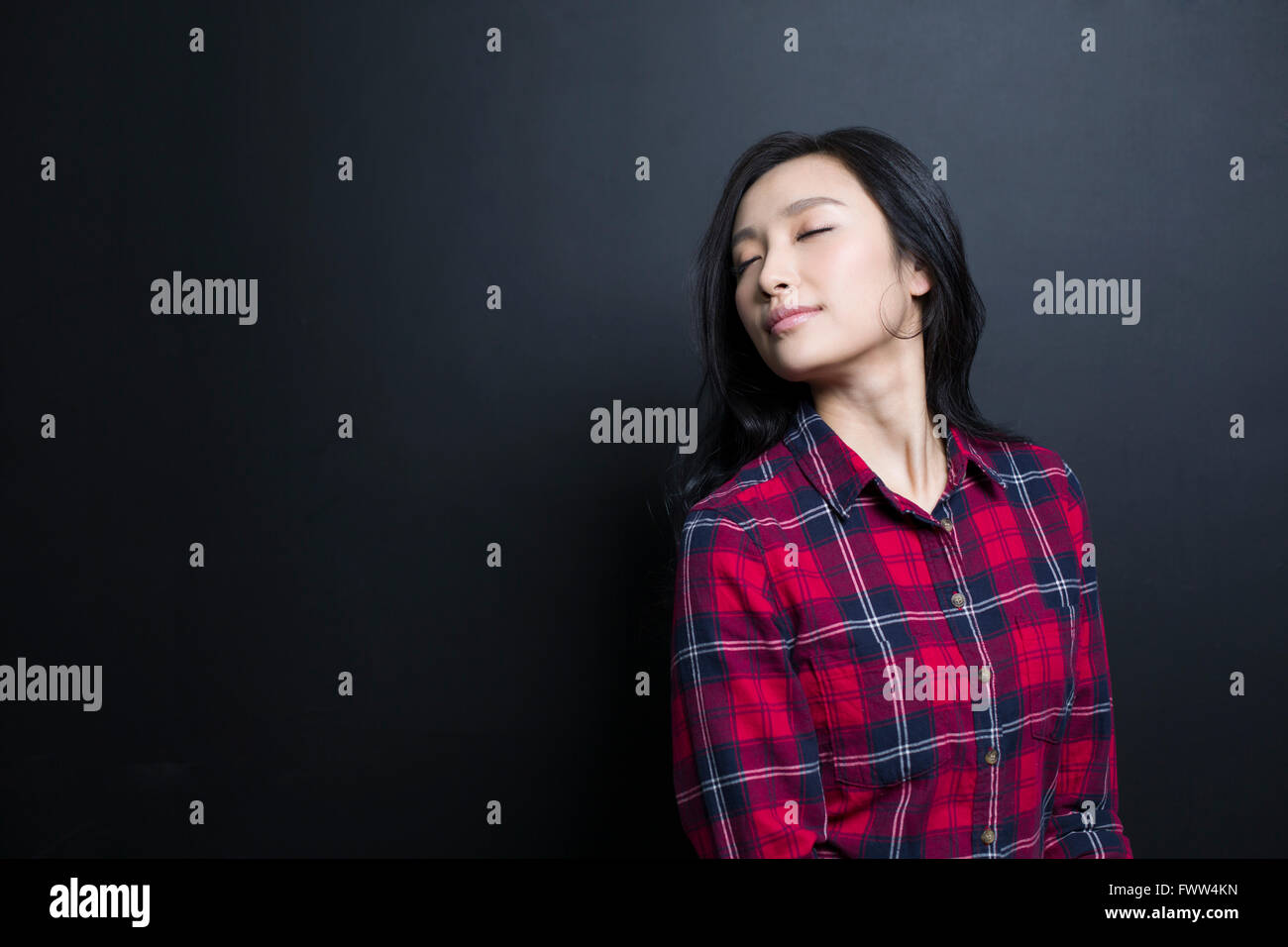 Happy thinking young woman hi-res stock photography and images - Alamy