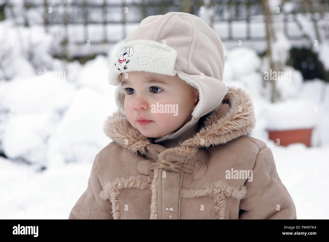 Boy playing in snow Stock Photo