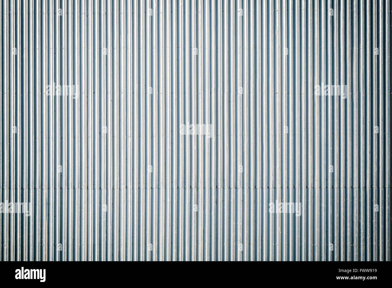 Vintage toned corrugated metal roof, picture taken from above, industrial background or texture. Stock Photo