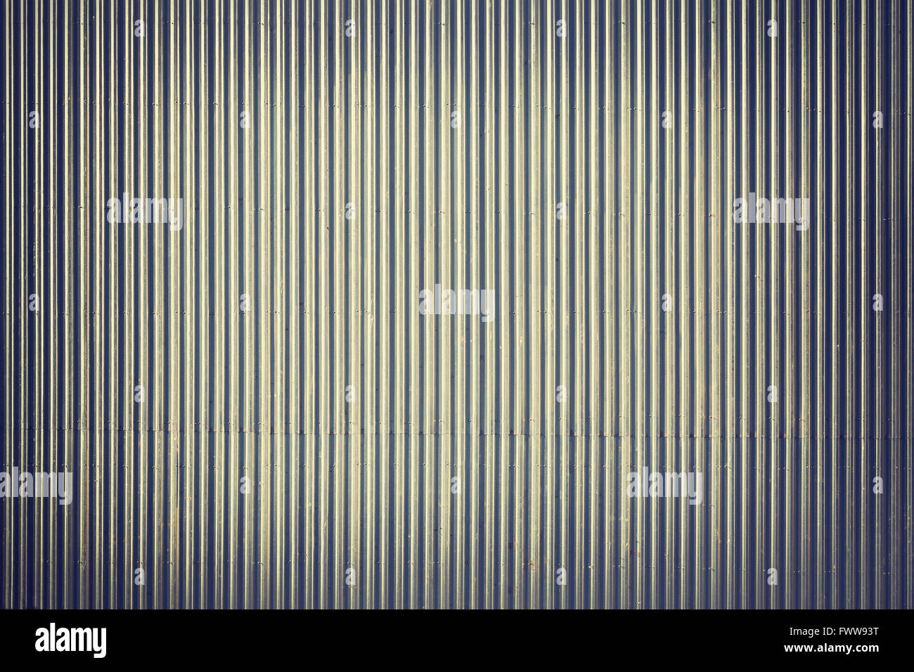 Vintage stylized corrugated metal roof, picture taken from above, industrial background or texture. Stock Photo