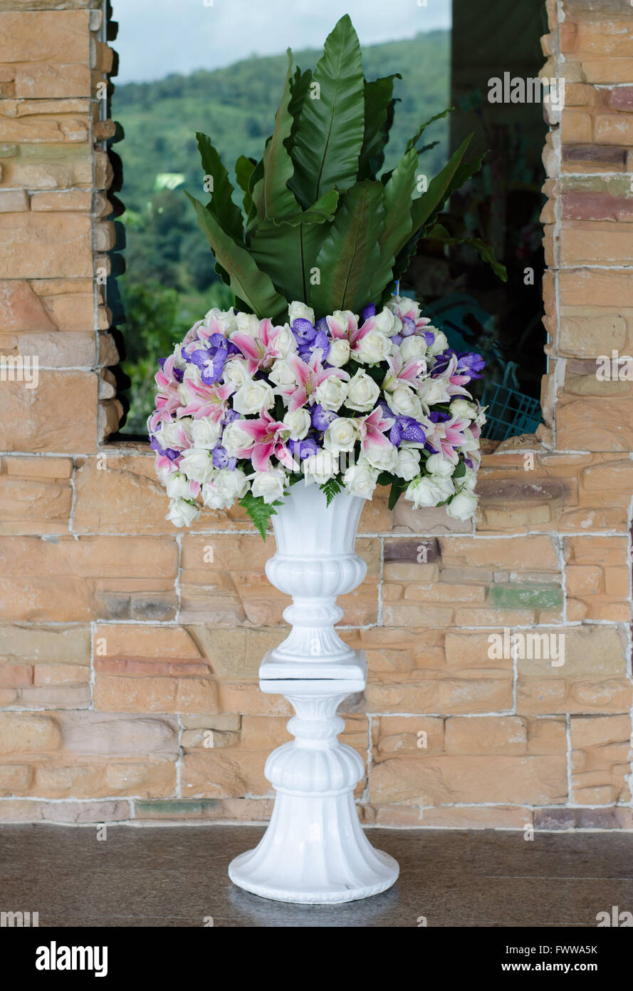 Bunch of flowers in a big decorative vase Stock Photo
