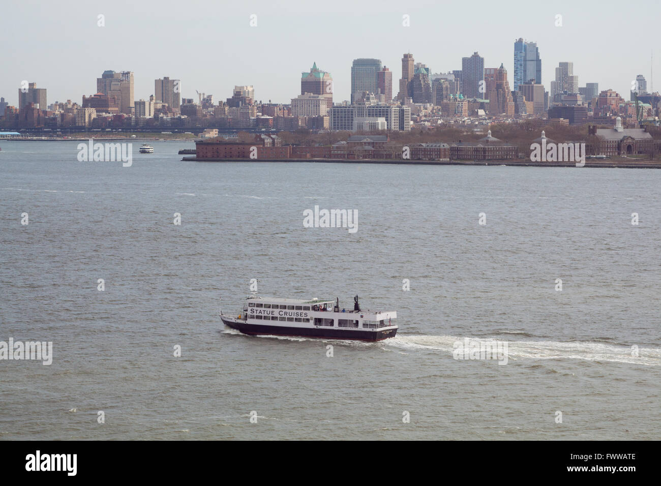 Statue Cruises passenger ferry taking tourists to the Statue of Liberty