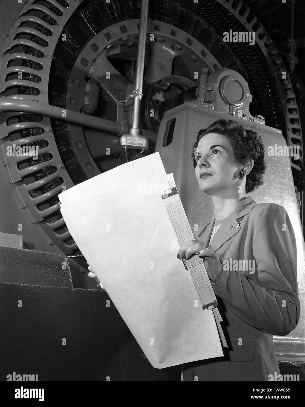 NACA Memorial Langley Aeronautical Laboratory electrical engineer Kitty O'Brien Joyner in front of a wind tunnel April 7, 1952 in Langley, Virginia. Joyner was the first woman engineer hired at the Langley Research Center managing wind tunnels and a variety of management positions. Stock Photo