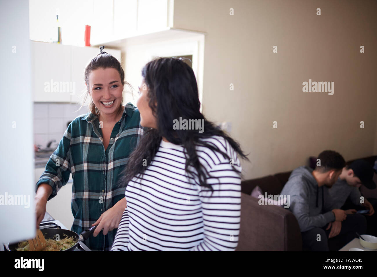 Group Of Students Hanging Out In Shared House Together Stock Photo