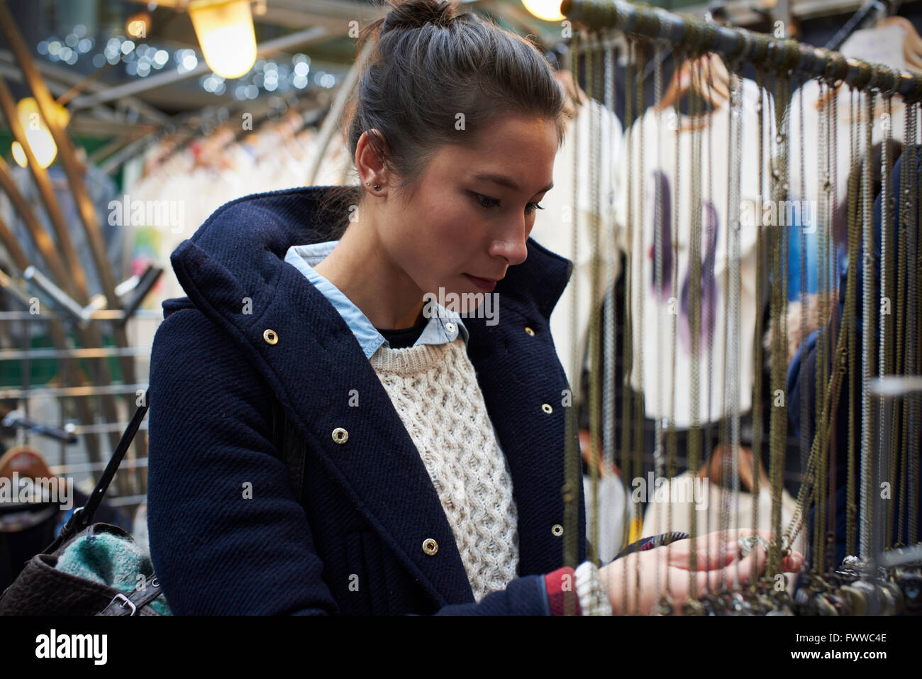 Young Woman Shopping In Covered Market Stock Photo