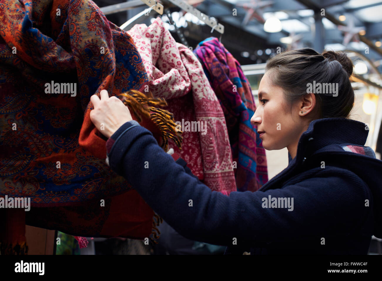 Young Woman Shopping In Covered Market Stock Photo