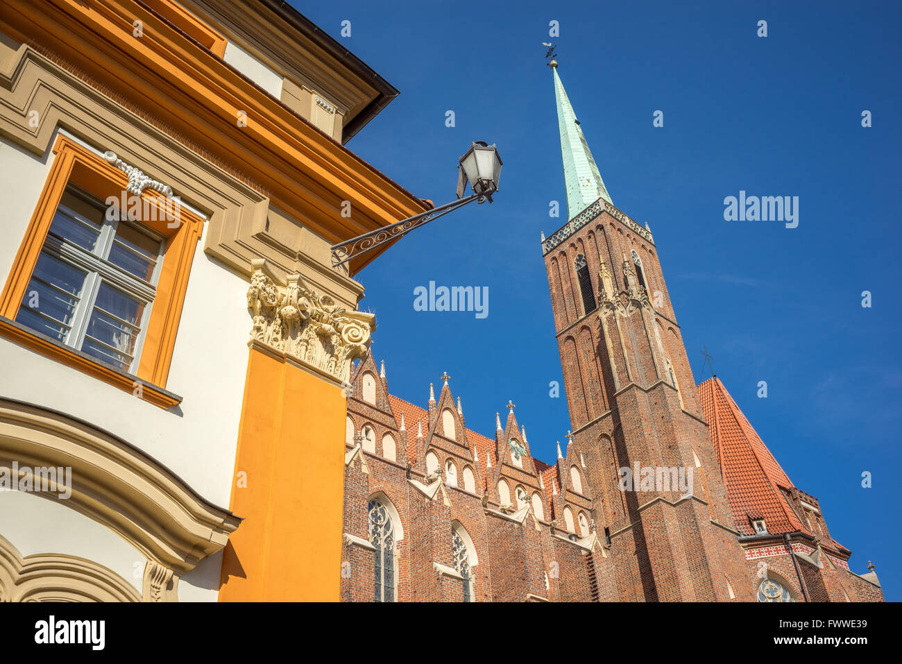 Holy Cross Church tower against blue sky Wroclaw Ostrow Tumski Stock Photo