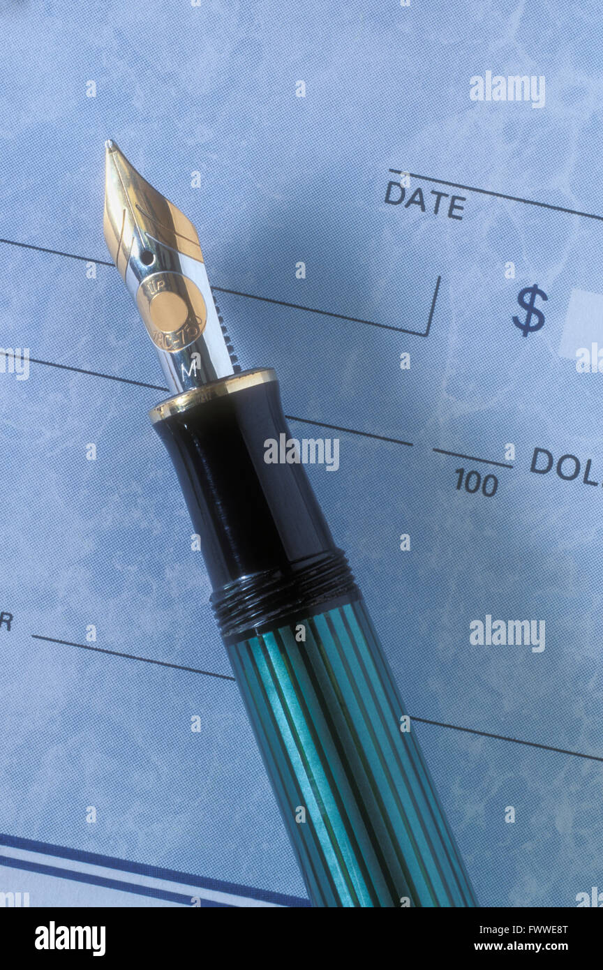 Fountain Pen and Blank Cheque Stock Photo
