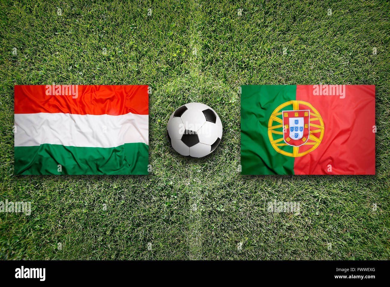 Hungary vs. Portugal flags on green soccer field Stock Photo Alamy