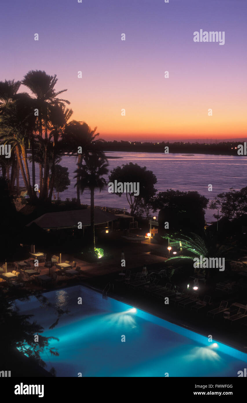 View of The Nile River and a Swimming Pool at Dusk, Luxor, Egypt Stock