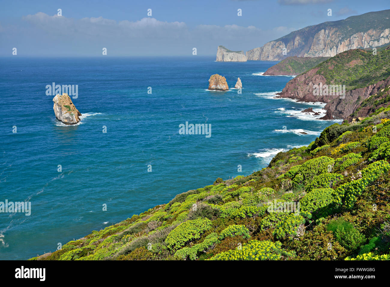 Coastline, behind rocky island Pan di Zucchero, Nebida, Golfo di Gonnesa, Sardinia, Italy Stock Photo