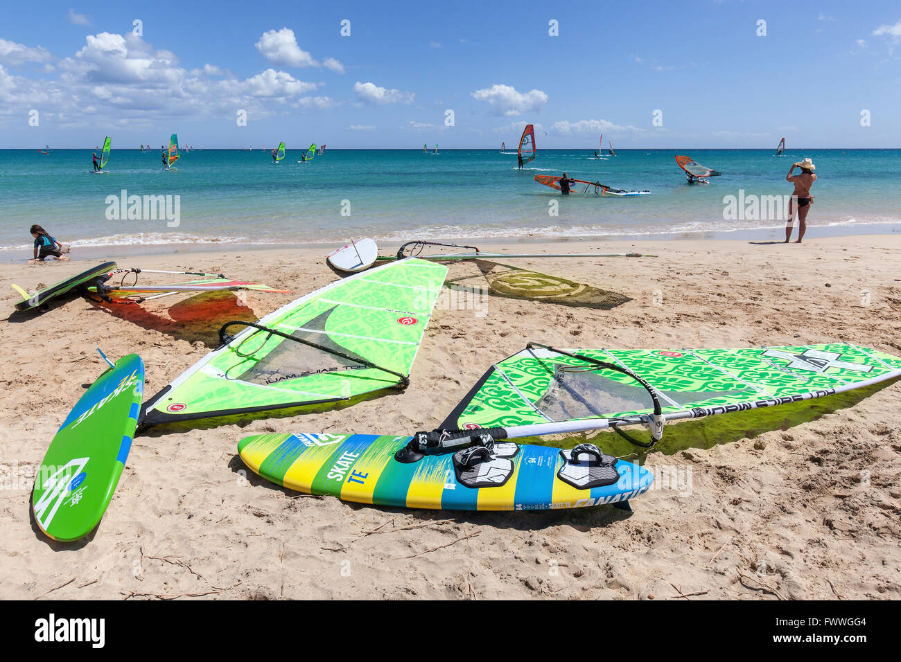 Windsurfing boards and sails lying on the beach, Playa Risco del Paso, Playa de Sotavento, Jandia, Fuerteventura, Canary Islands Stock Photo