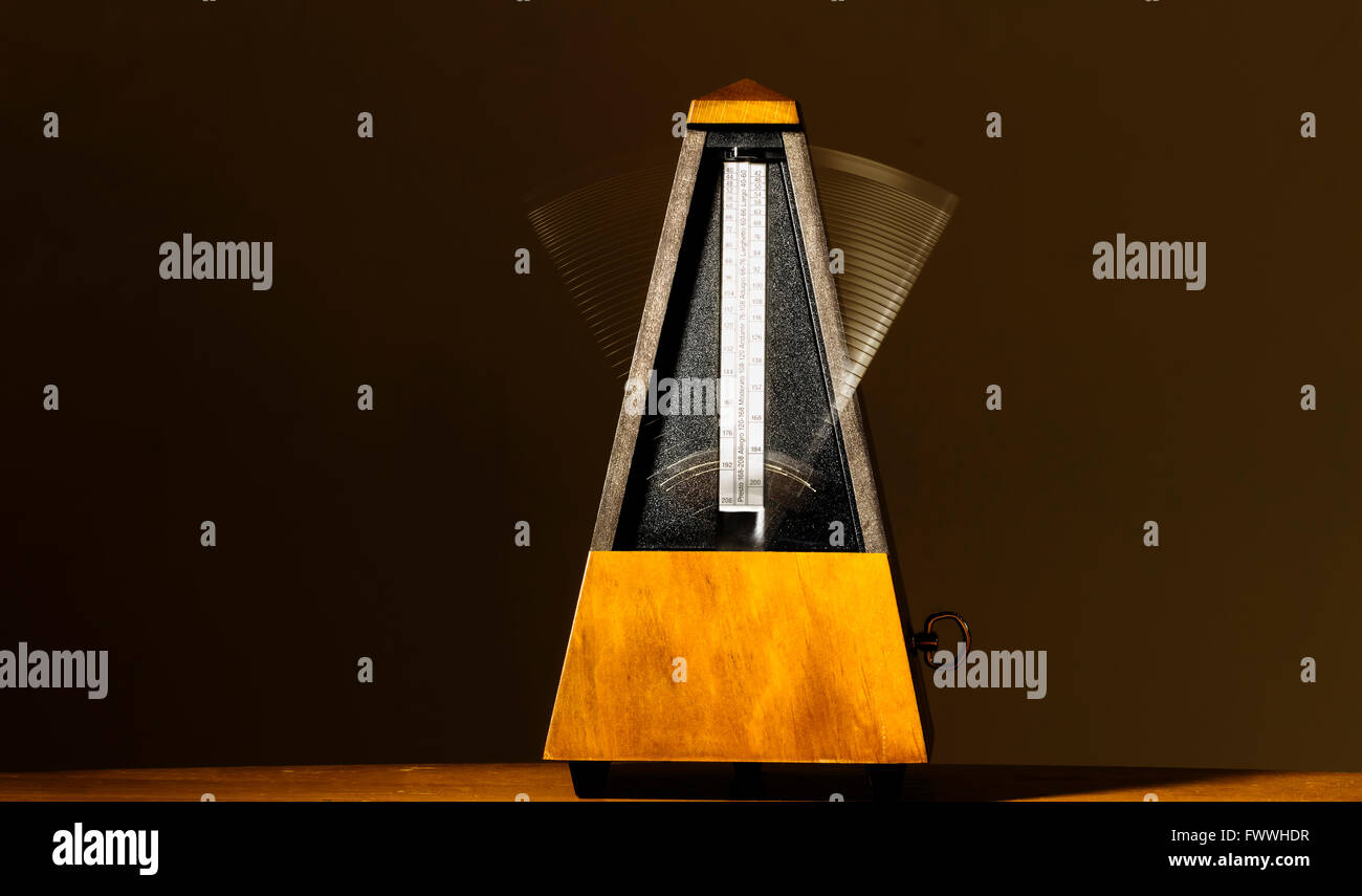 Wooden Mechanical Metronome With Motion From Arm Movement Stock Photo