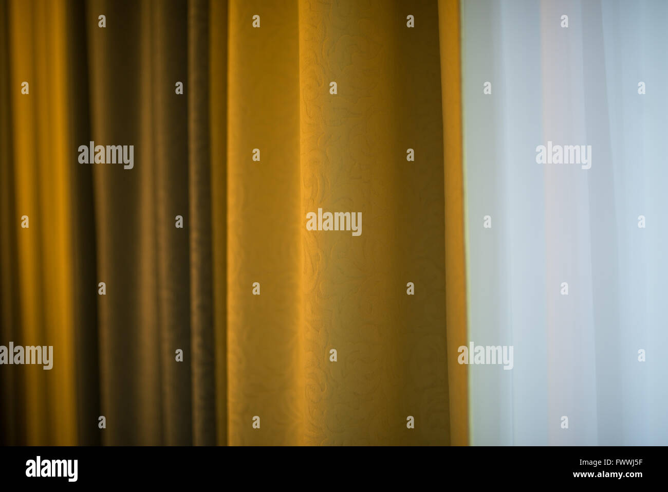 folded curtain gold color Stock Photo